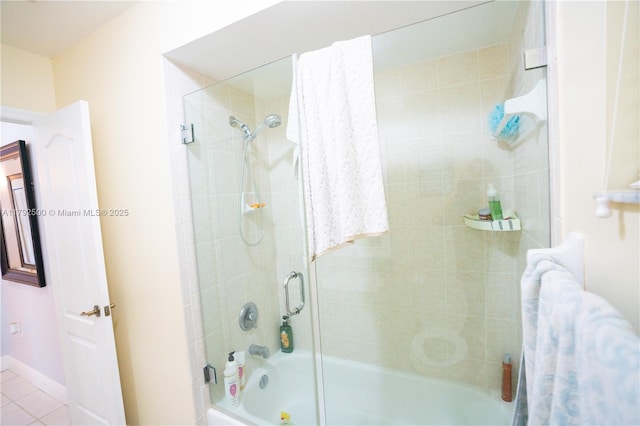 full bath featuring tile patterned flooring, baseboards, and combined bath / shower with glass door