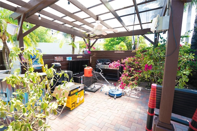 view of patio featuring a pergola, ceiling fan, and a fenced backyard