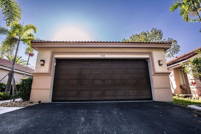 1558 Sunset Way, Weston, FL 33327 - garage featuring aphalt driveway