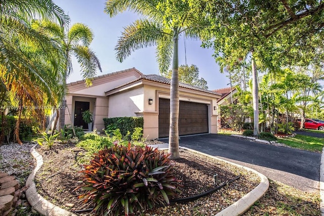1558 Sunset Way, Weston, FL 33327 - view of front of house with a garage, stucco siding, driveway, and a tile roof