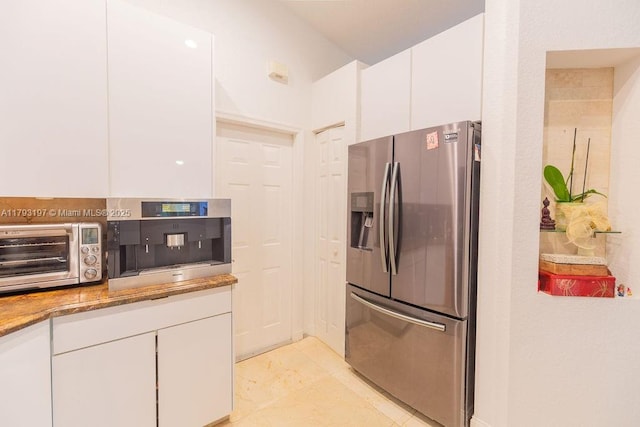 1558 Sunset Way, Weston, FL 33327 - kitchen featuring stainless steel fridge, stone countertops, a toaster, and white cabinetry