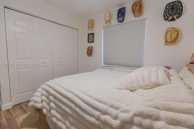 1558 Sunset Way, Weston, FL 33327 - bedroom featuring a closet and wood finished floors
