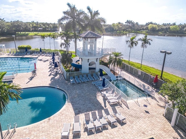 1558 Sunset Way, Weston, FL 33327 - community pool with a water view, fence, and a patio area