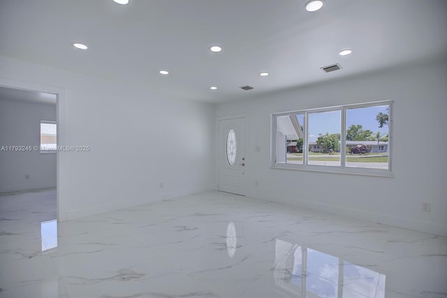spare room featuring recessed lighting, baseboards, and visible vents