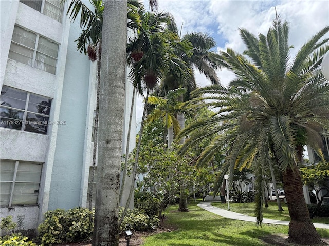 492 NW 165th St Rd Unit C-215, Miami, FL 33169 - exterior space featuring a lawn and stucco siding