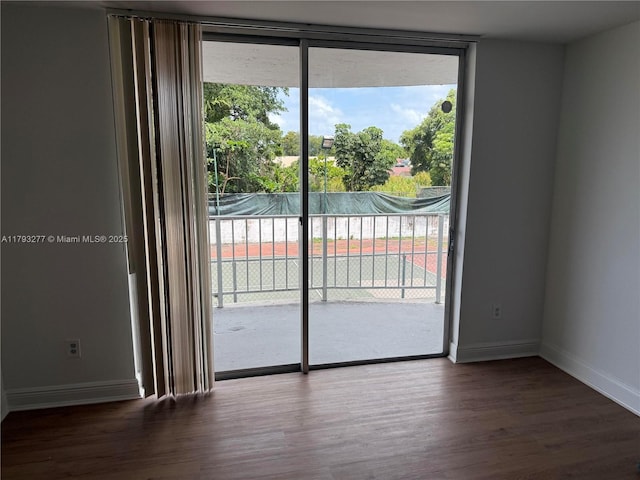 492 NW 165th St Rd Unit C-215, Miami, FL 33169 - entryway with baseboards and wood finished floors