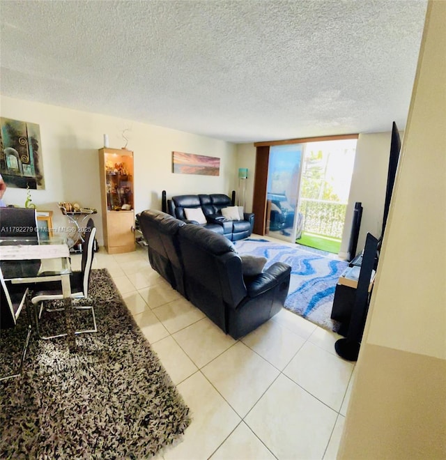 7705 Abbott Ave Unit 206, Miami Beach, FL 33141 - living room with light tile patterned flooring and a textured ceiling
