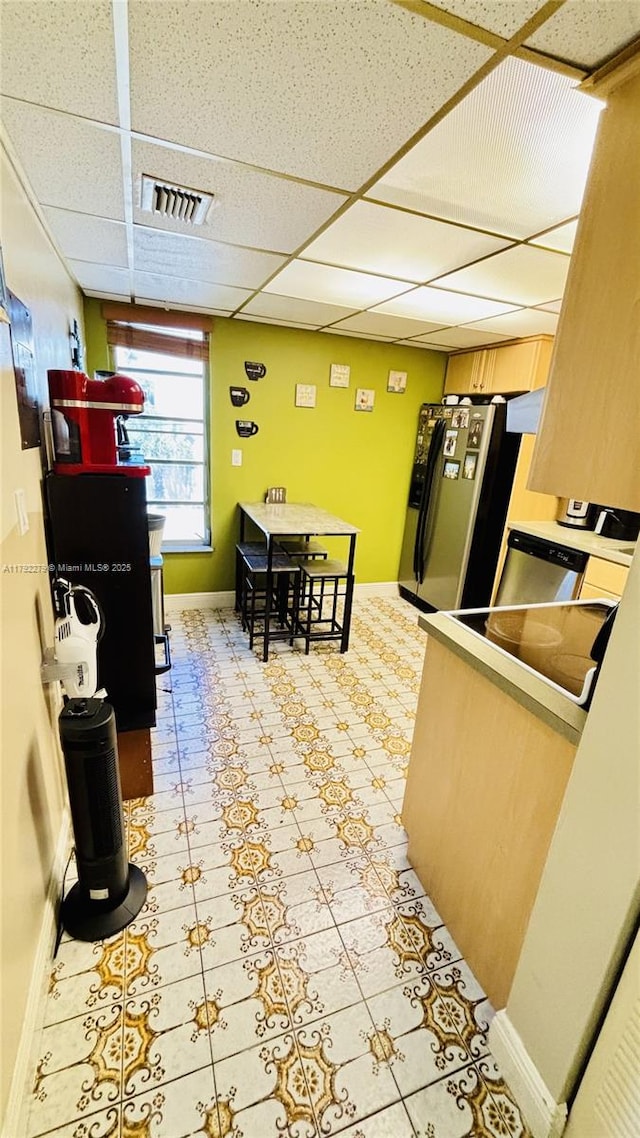 7705 Abbott Ave Unit 206, Miami Beach, FL 33141 - kitchen featuring freestanding refrigerator, baseboards, visible vents, and a paneled ceiling