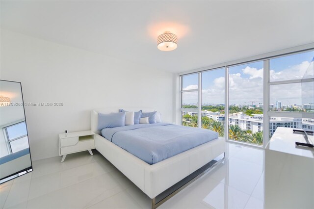 10275 Collins Ave Unit 731, Bal Harbour, FL 33154 - bedroom with a view of city, multiple windows, light tile patterned floors, and floor to ceiling windows
