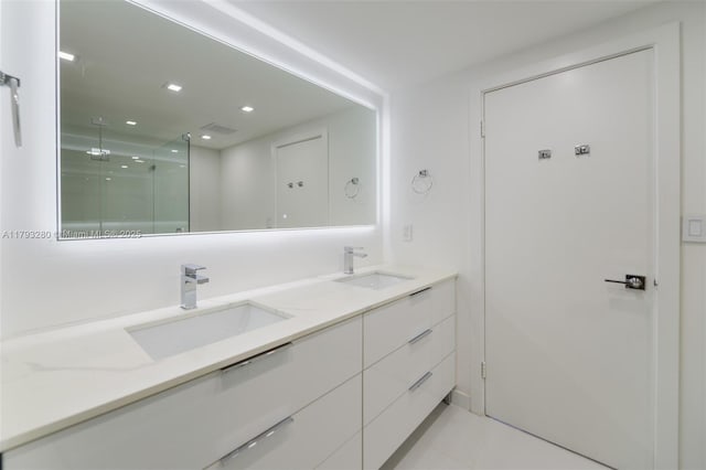 10275 Collins Ave Unit 731, Bal Harbour, FL 33154 - full bathroom with double vanity, a shower stall, tile patterned floors, and recessed lighting
