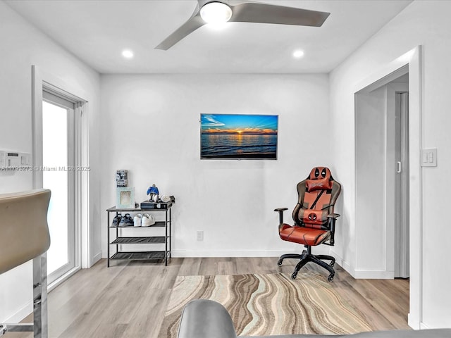 living area with a ceiling fan, baseboards, recessed lighting, and wood finished floors