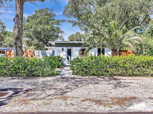 view of front of property featuring fence