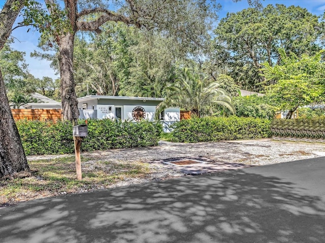 view of front of home featuring fence