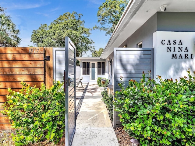 property entrance featuring a gate and fence