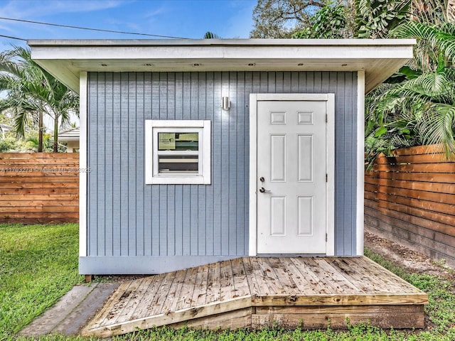 view of shed with fence