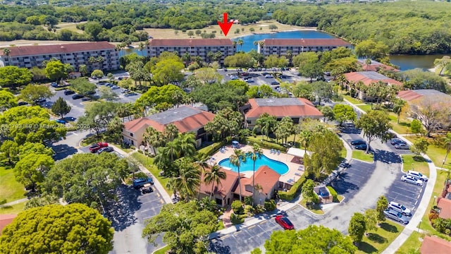 birds eye view of property featuring a water view