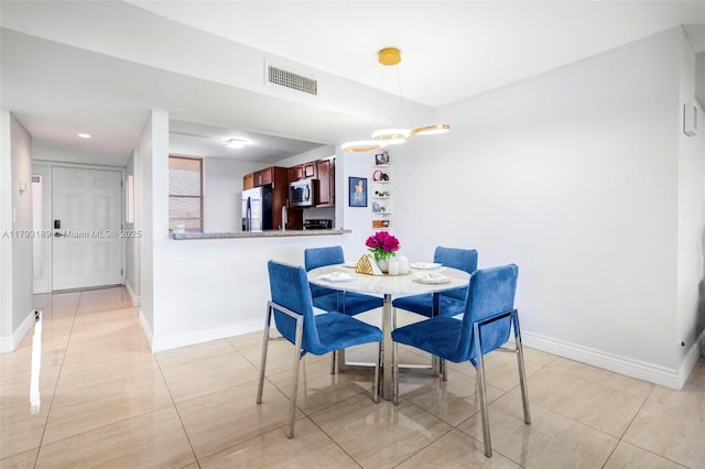 dining area with baseboards, recessed lighting, light tile patterned flooring, and visible vents
