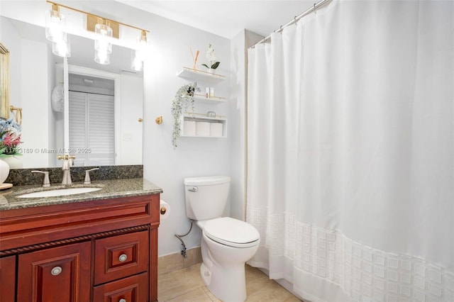 bathroom featuring vanity, tile patterned flooring, toilet, and a shower with curtain