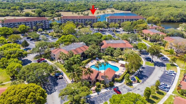 2767 S Carambola Cir S Unit 506, Coconut Creek, FL 33066 - aerial view of property and surrounding area featuring a large body of water and a pool area
