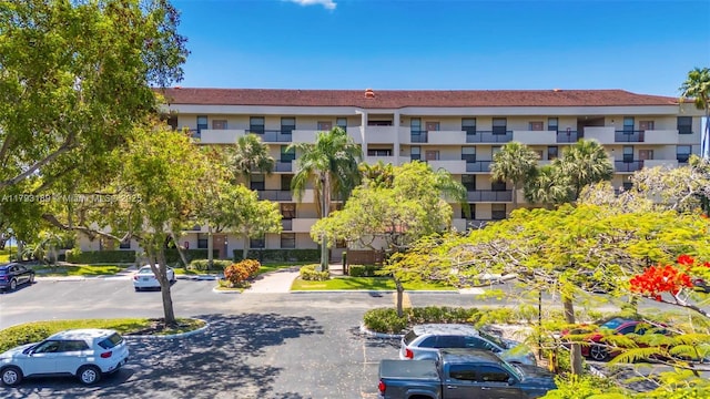 2767 S Carambola Cir S Unit 506, Coconut Creek, FL 33066 - view of property featuring uncovered parking