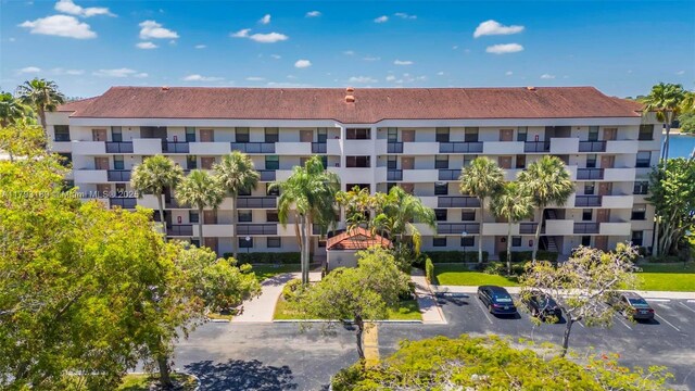 2767 S Carambola Cir S Unit 506, Coconut Creek, FL 33066 - view of apartment building / complex featuring uncovered parking