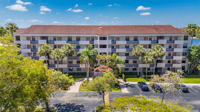 2767 S Carambola Cir S Unit 506, Coconut Creek, FL 33066 - view of apartment building / complex featuring uncovered parking