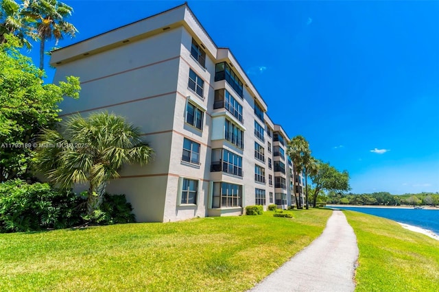 view of building exterior with a water view