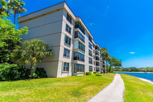 2767 S Carambola Cir S Unit 506, Coconut Creek, FL 33066 - view of apartment building / complex with a water view