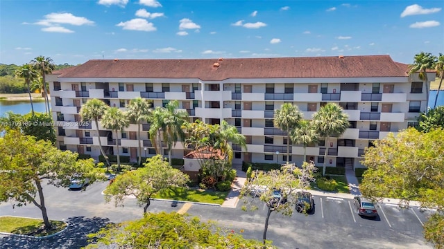 2767 S Carambola Cir S Unit 506, Coconut Creek, FL 33066 - view of apartment building / complex featuring uncovered parking