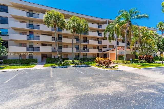 2767 S Carambola Cir S Unit 506, Coconut Creek, FL 33066 - view of apartment building / complex with uncovered parking