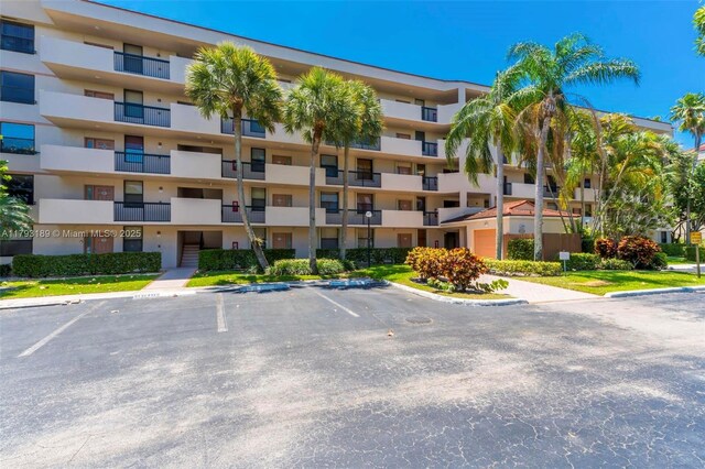 2767 S Carambola Cir S Unit 506, Coconut Creek, FL 33066 - view of apartment building / complex with uncovered parking