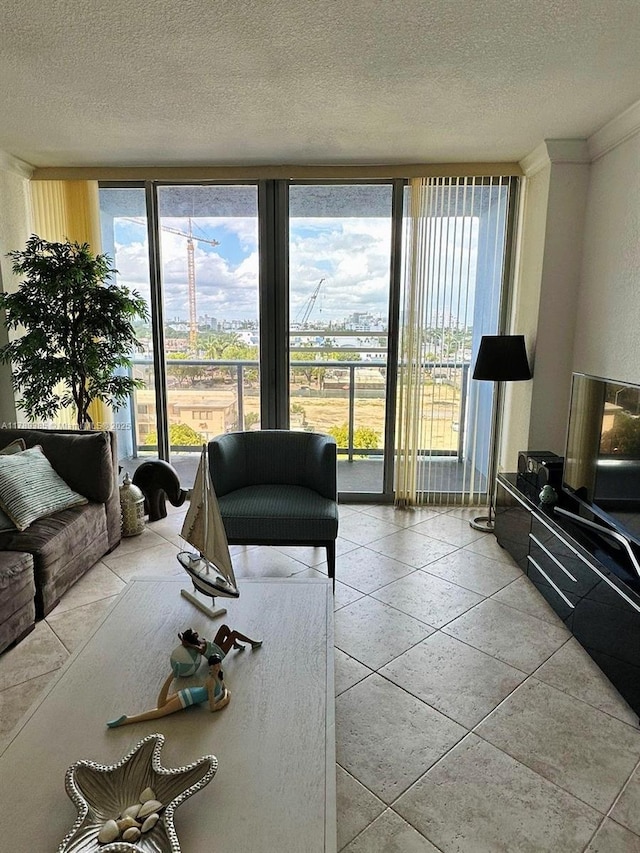 401 69th St Unit 607, Miami Beach, FL 33141 - living room featuring crown molding and a textured ceiling