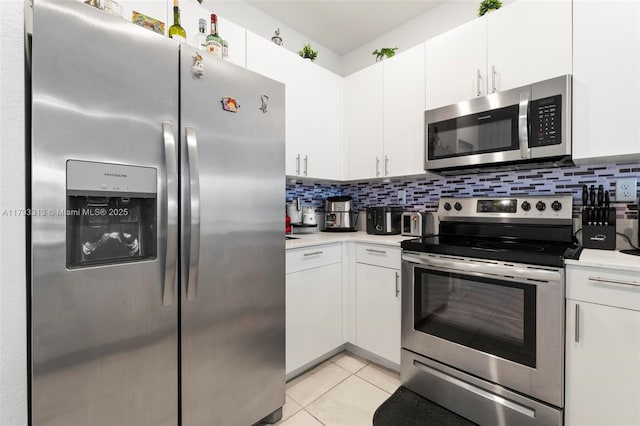 12901 SW 232nd Ln, Homestead, FL 33032 - kitchen featuring light countertops, white cabinetry, and stainless steel appliances