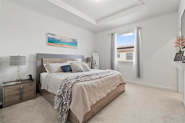 12901 SW 232nd Ln, Homestead, FL 33032 - bedroom featuring a raised ceiling, baseboards, and light carpet