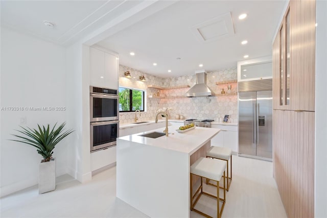 1375 SW 17th Ter, Miami, FL 33145 - kitchen featuring appliances with stainless steel finishes, wall chimney exhaust hood, modern cabinets, open shelves, and light countertops
