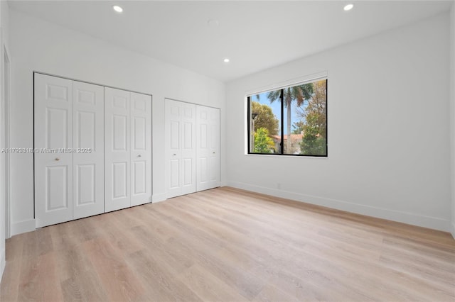 1375 SW 17th Ter, Miami, FL 33145 - unfurnished bedroom featuring two closets, light wood-style floors, recessed lighting, and baseboards