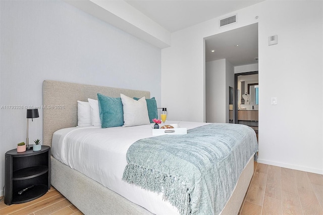 398 NE 5th St Unit 2517, Miami, FL 33132 - bedroom with visible vents, baseboards, and wood finished floors