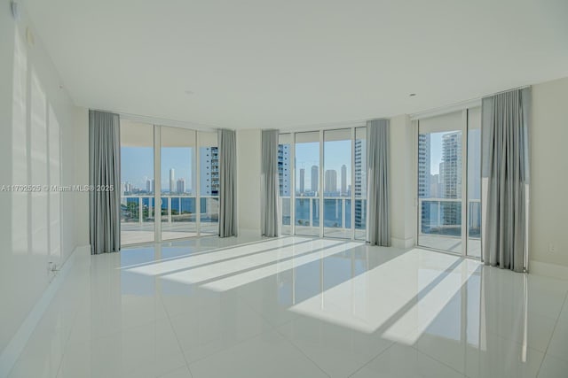 empty room featuring tile patterned flooring and a city view