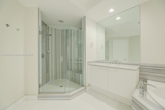 full bath with tile patterned flooring, a garden tub, vanity, recessed lighting, and a stall shower