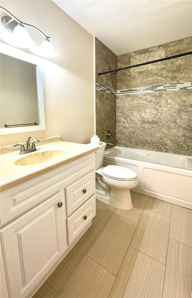 full bath with vanity, shower / bathing tub combination, and toilet