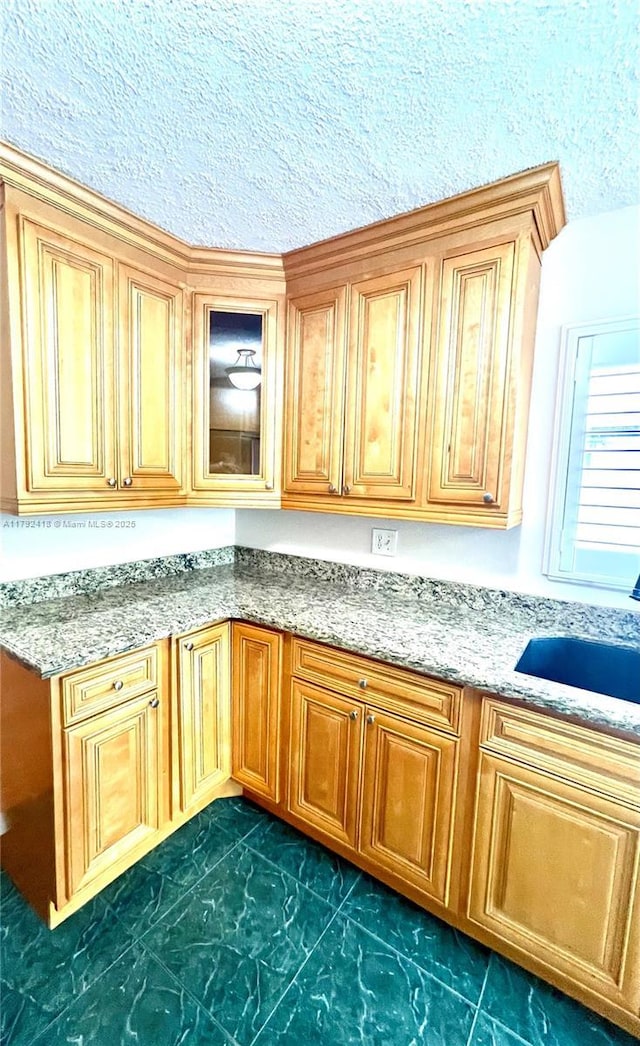 interior space featuring a sink and marble finish floor