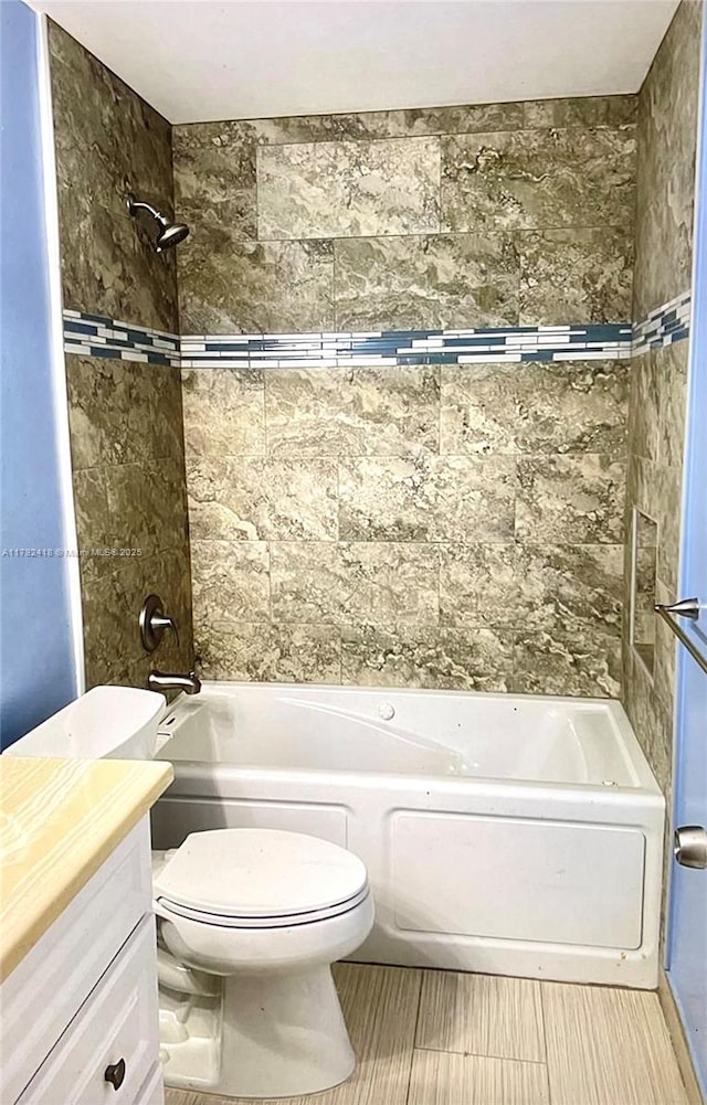 bathroom with vanity, toilet, and bathtub / shower combination