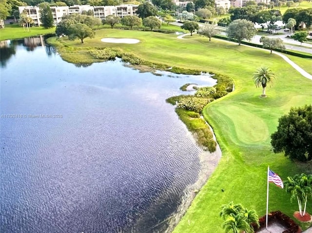 birds eye view of property featuring view of golf course and a water view