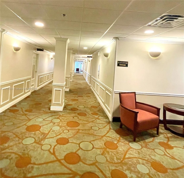 2141 SW 93rd Way Unit 704, Davie, FL 33324 - building lobby with a decorative wall, a drop ceiling, and a wainscoted wall