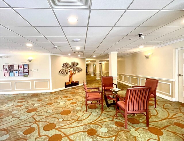 2141 SW 93rd Way Unit 704, Davie, FL 33324 - sitting room with a decorative wall, a wainscoted wall, and ornamental molding