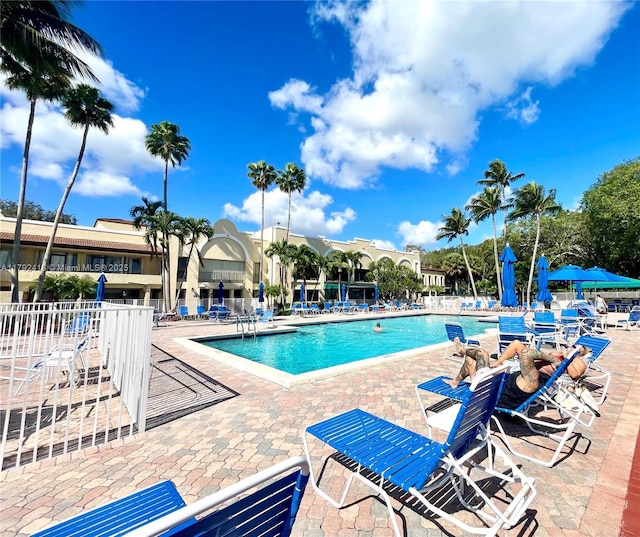 2141 SW 93rd Way Unit 704, Davie, FL 33324 - community pool featuring a patio