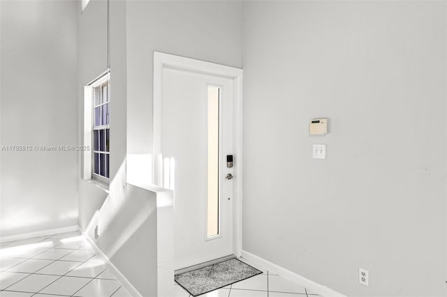 interior space featuring baseboards and tile patterned floors