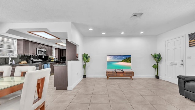 19241 SW 93rd Rd, Cutler Bay, FL 33157 - living room with recessed lighting, light tile patterned floors, and baseboards