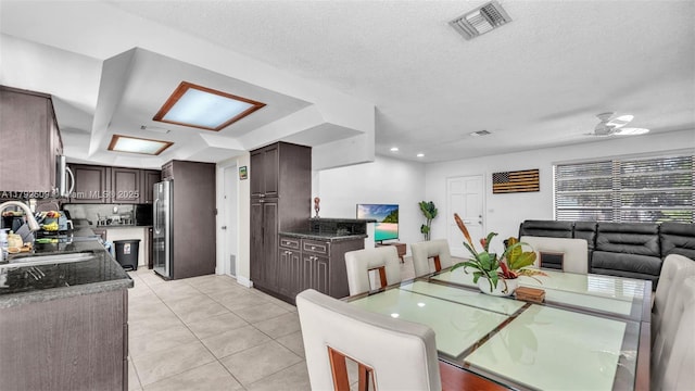 19241 SW 93rd Rd, Cutler Bay, FL 33157 - dining area with light tile patterned flooring and a textured ceiling