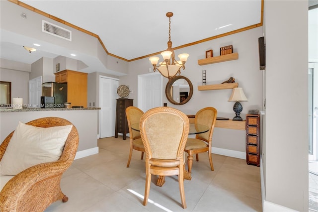 dining space featuring crown molding, an inviting chandelier, baseboards, light tile patterned floors, and visible vents